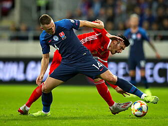 Wales win sets up Slovakia dat...